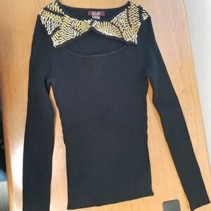 Camille Large black long sleeve top with wooden beaded accents.